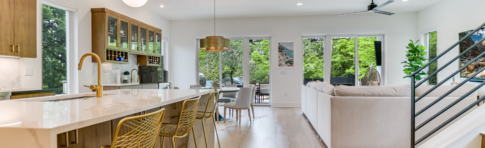 Modern open-concept Austin home with dining area, living room, and kitchen representing the trusted home management services of Queen of To Do-1