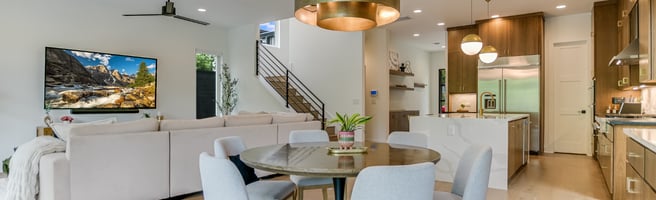 Modern open-concept Austin home with dining area, living room, and kitchen representing the trusted home management services of Queen of To Do