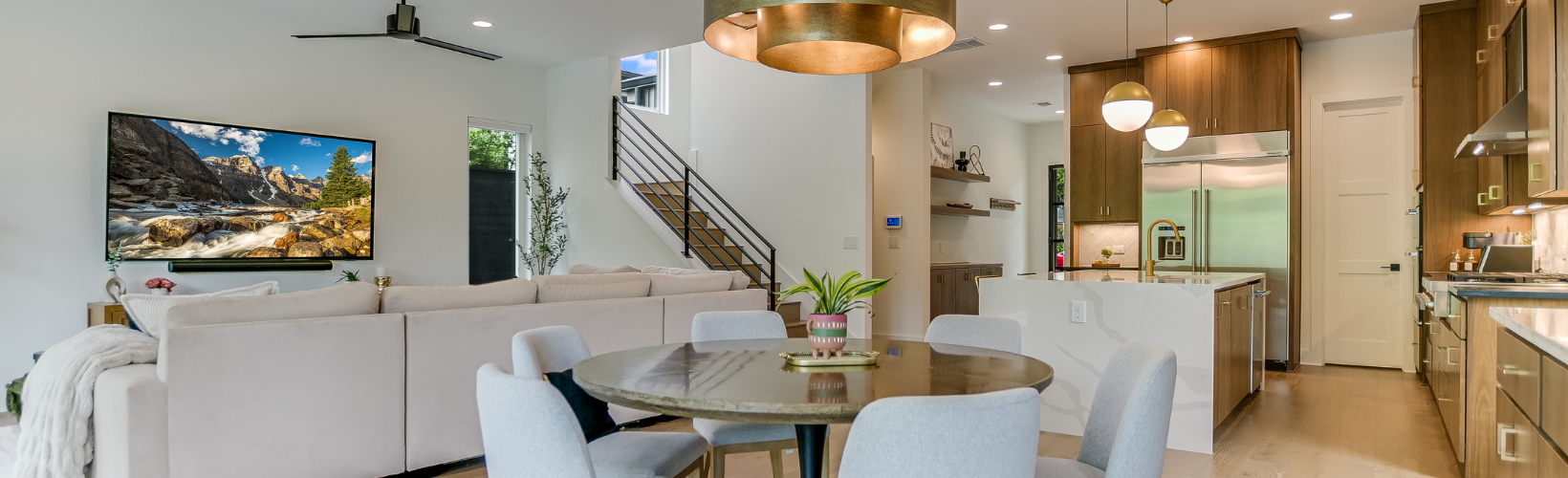 Modern open-concept Austin home with dining area, living room, and kitchen representing the trusted home management services of Queen of To Do